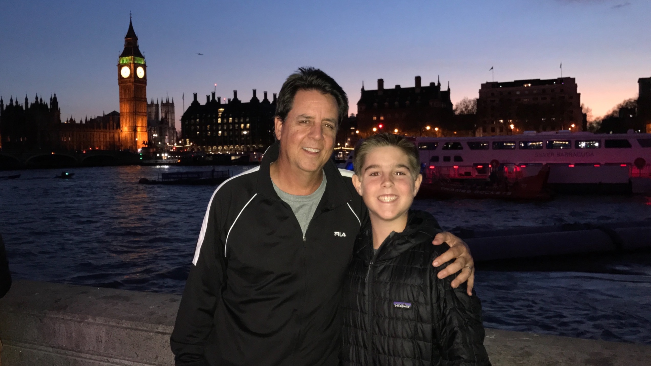 Travis and Tim Hackett enjoy sunset over the Thames River
